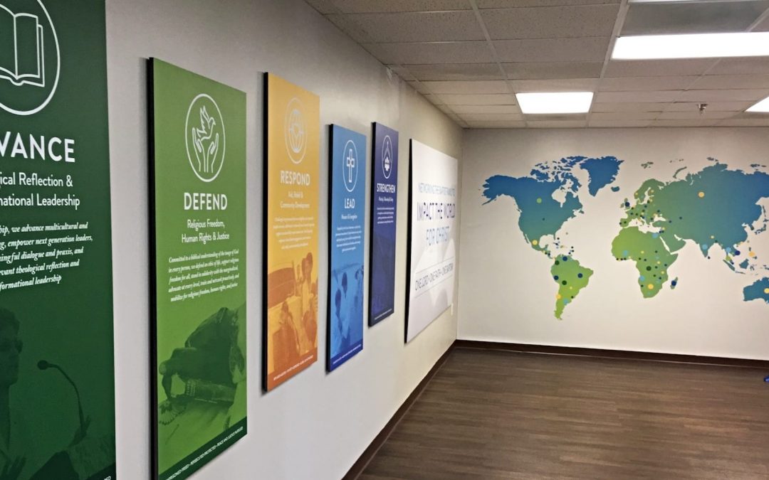 Posters and a map of the world on the wall at the Baptist World Alliance building