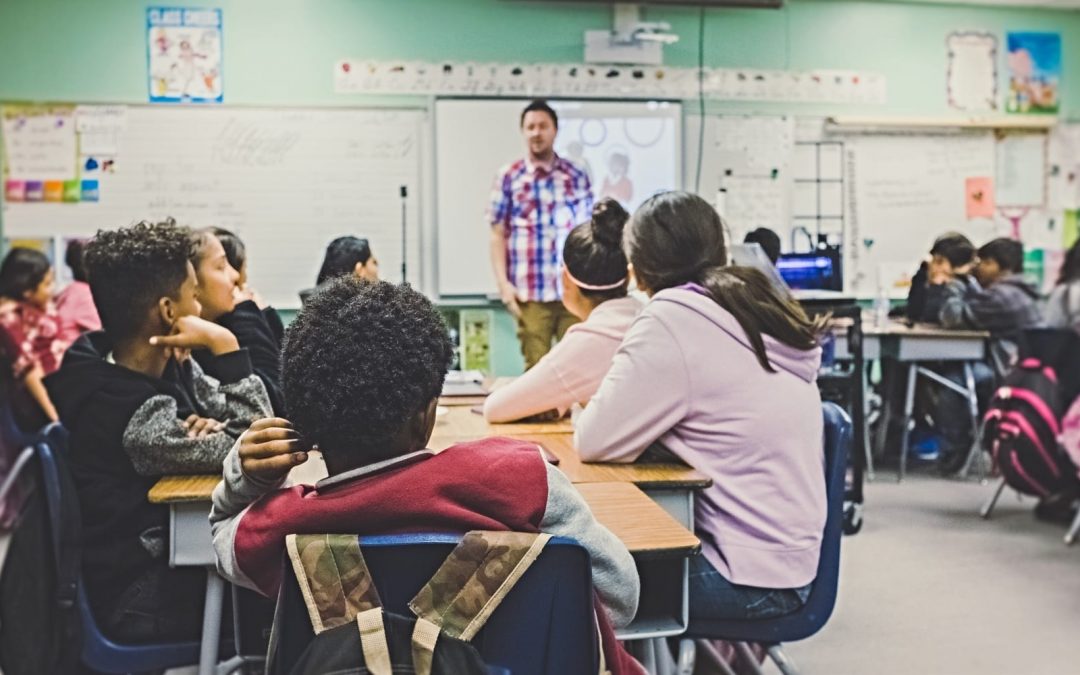 school classroom with students and teacher