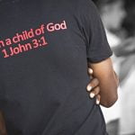 Young African American man with T-shirt with 1 John 3:1