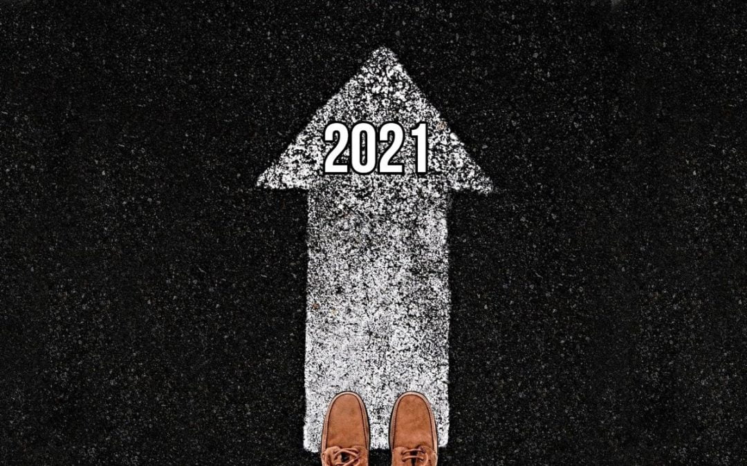 Feet standing at end of arrow pointing forward to 2021