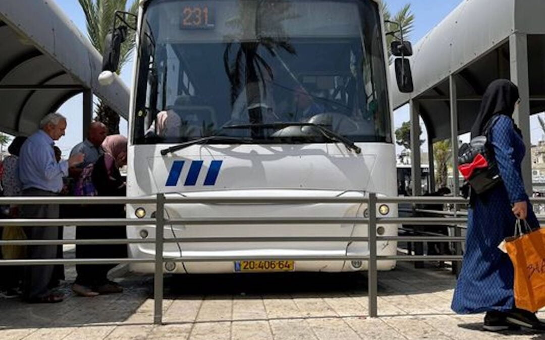 A white bus, seen from the front, with passengers getting onto it. Probably no group has suffered more over the centuries at the hands of Christianity than Jews.