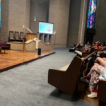 Women gathered in the sanctuary for the 2023 Nevertheless She Preached conference in Austin, Texas.