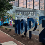 The word “hope” spelled out and displayed on a city street.