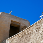 Crosses top the 17th-century San Estévan del Rey Mission, where two annual celebrations are held by the Acoma Pueblo featuring traditional dance.