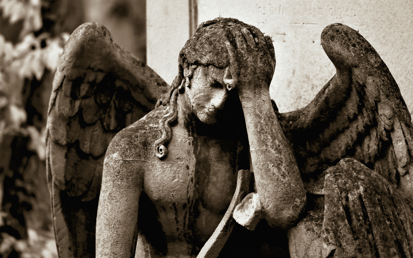 A stone image of an angel grieving