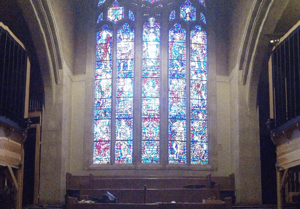 A photo of the stained-glass window and organ at the First Baptist Church of the City of Washington, D.C.