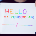 A whiteboard with a space to list a person’s pronouns.