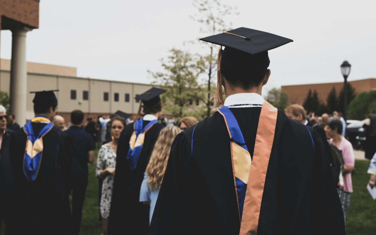 A photo of college graduates from behind.