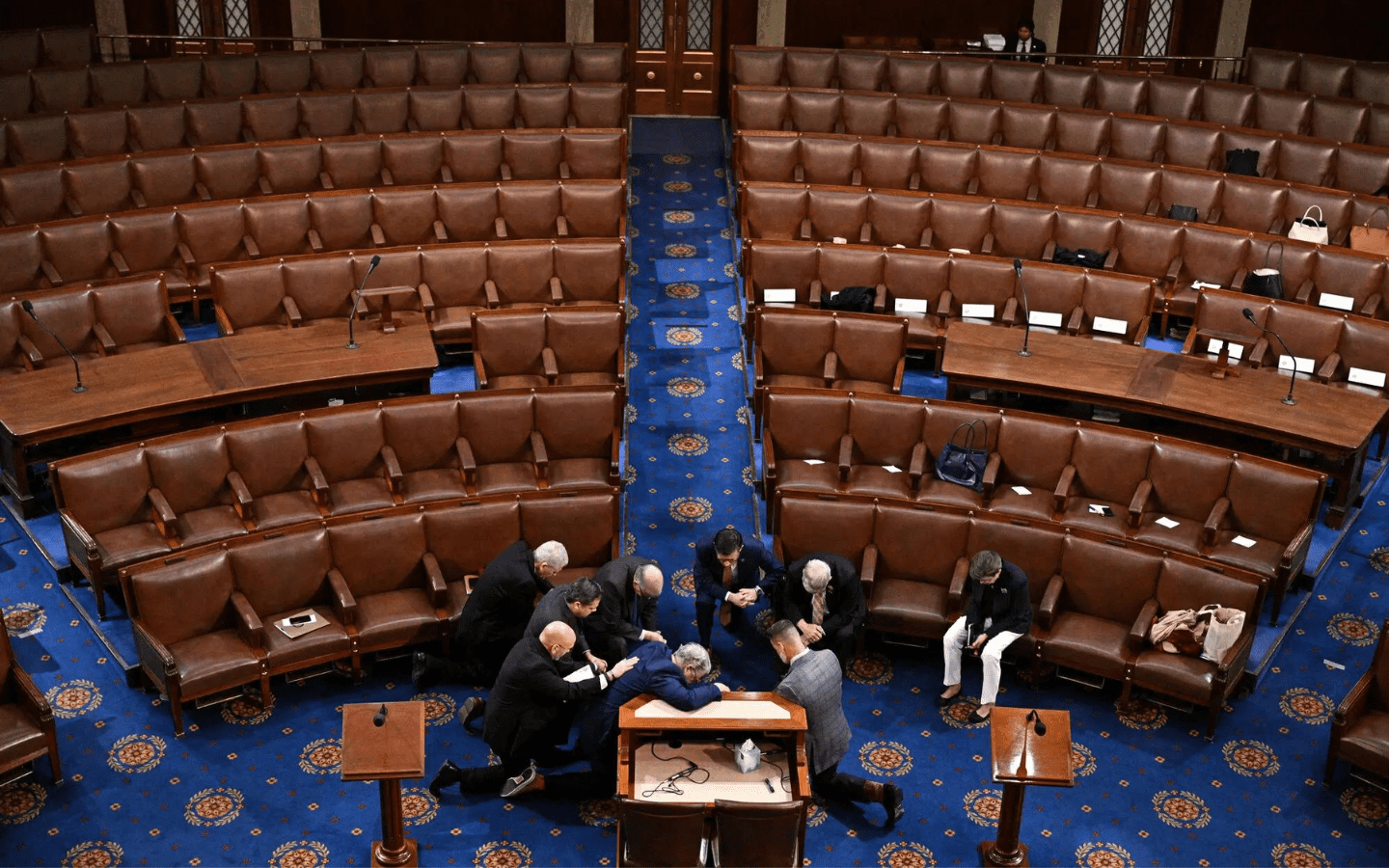 Mike Johnson leads prayer on house floor.