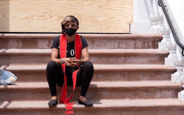 Woman seated on the steps of St. John’s Episcopal Church in Washington