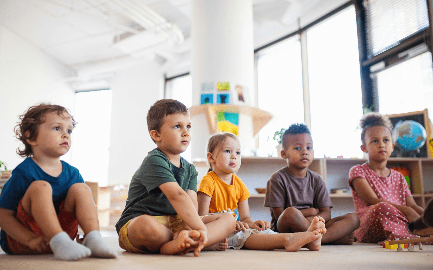 A photo of young children in a daycare-type setting