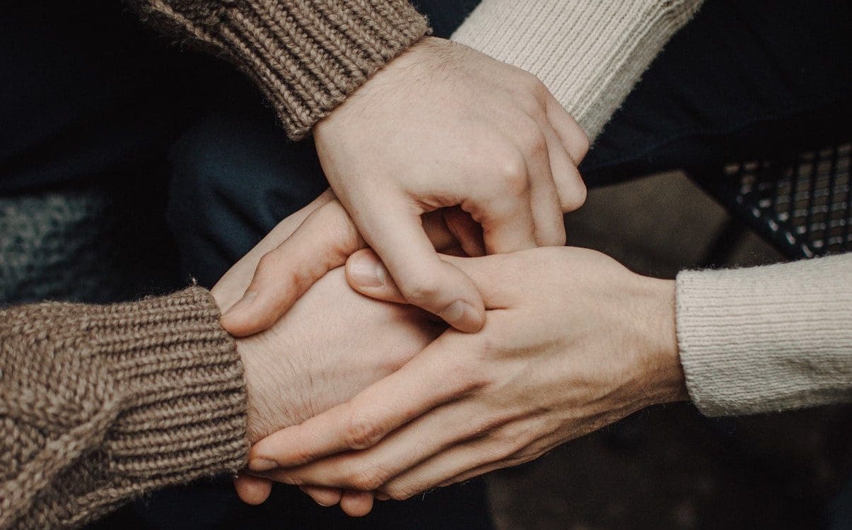 Two people holding hands.