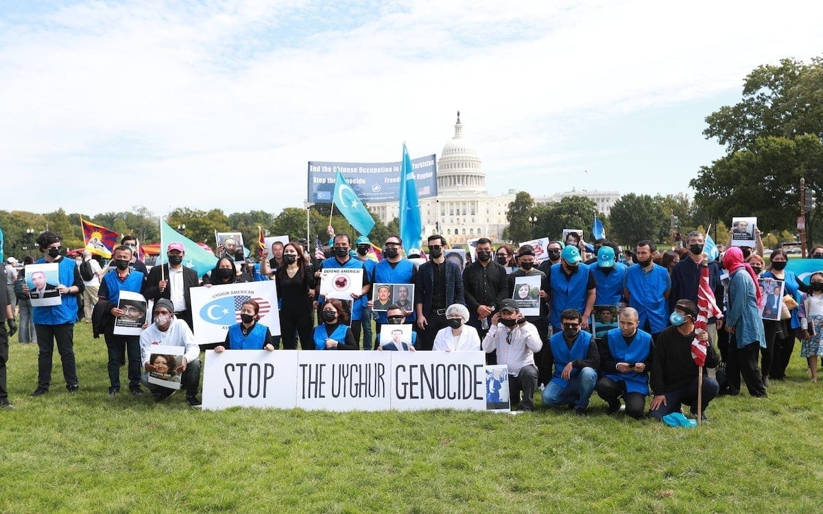 A group of protestors speaking out against the genocide of the Uyghur people in China
